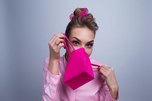 Shopping, sale, christmas and holiday concept - smiling woman with small shopping gift bag