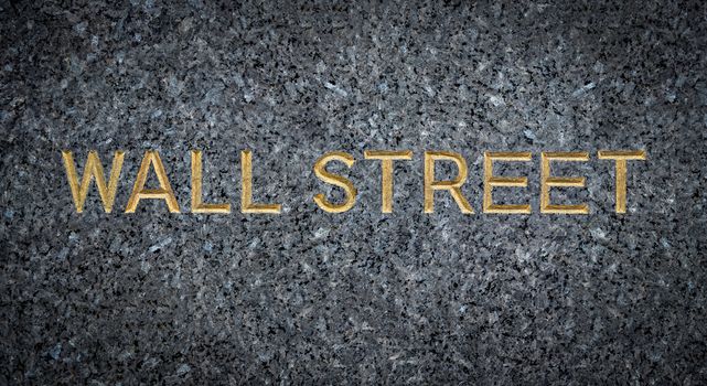 A Gold Engraved Sign For Wall Street In New York City (NYC) On Marble
