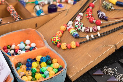 Scattering of multi-colored glass beads close up