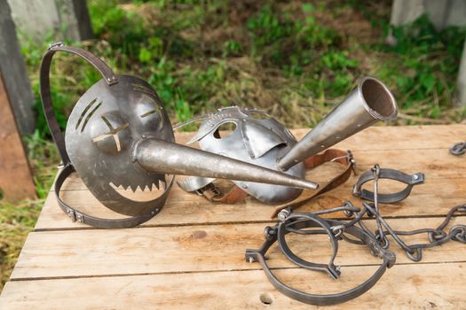 two terrible iron medieval masks for torture