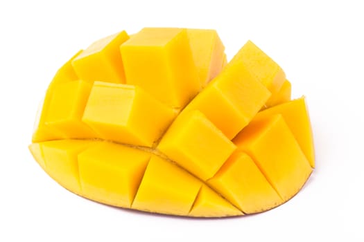 Mango slice cut to cubes close-up isolated on white background