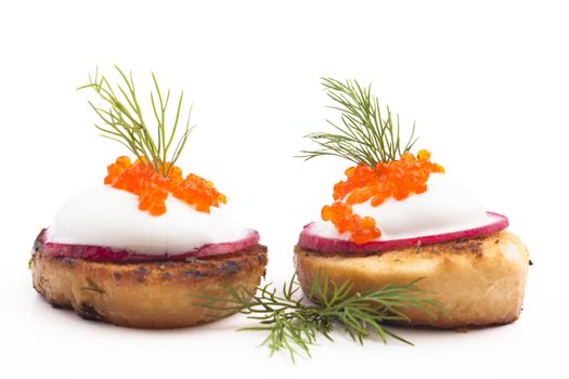 Red caviar on roasted bread and radish isolated on white background