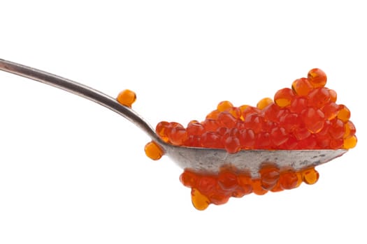Red caviar on a teaspoon close-up isolated on white background