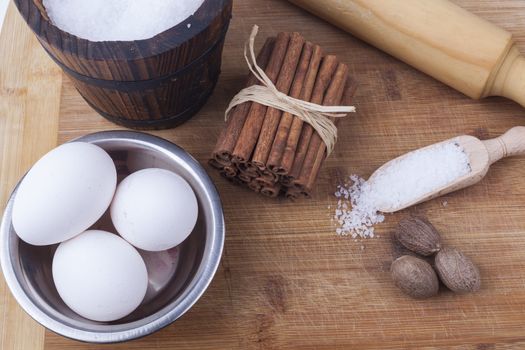 Baking ingredients preparation on brown wod board