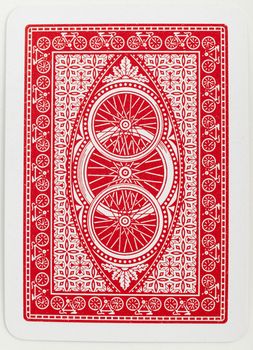 Playing card back red abstract floral pattern closeup