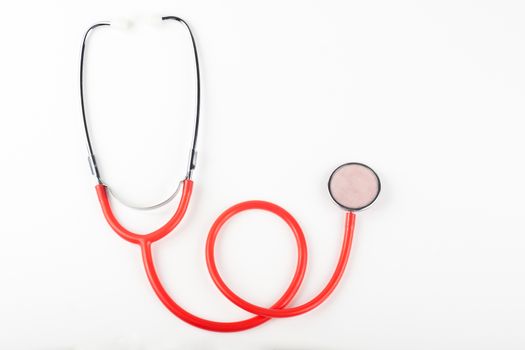 single red stethoscope isolated on white background