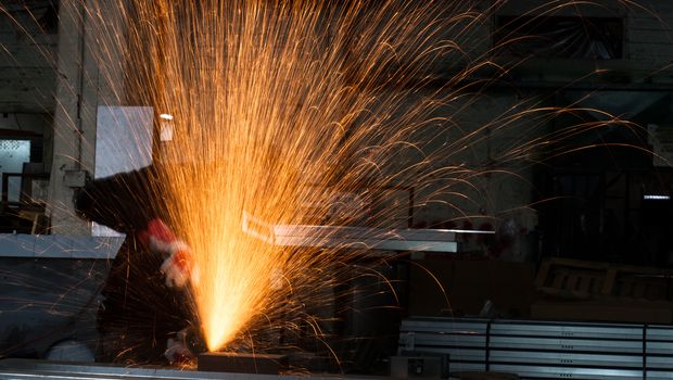 sparks explosion during grinding in a metal workshop