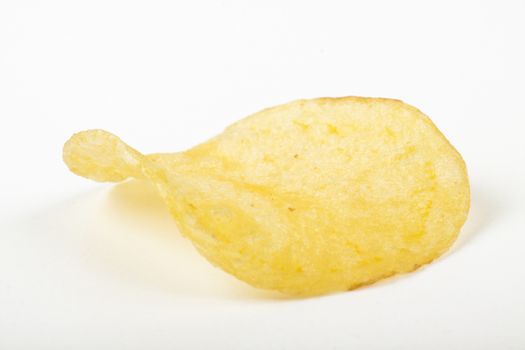 single yelow potato chip  isolated on white background