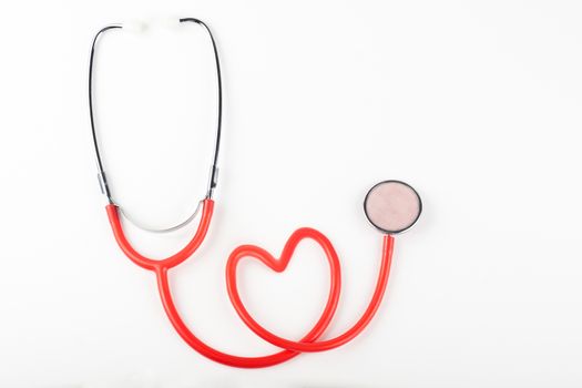 single red stethoscope isolated on white background