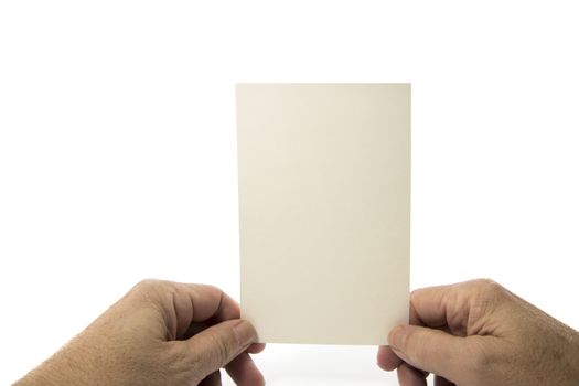 Hand holding blank plain paper isolated on white background