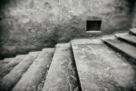 Staircase with window detail of old stone stairs, textured background, ancient architecture