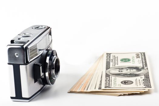 old silver camera some money and a globus 