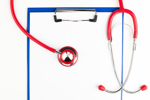 Red stethoscope on a empty  blue clipboard  crop isolated on white background