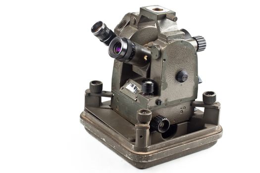 old small theodolite side view isolated on white background