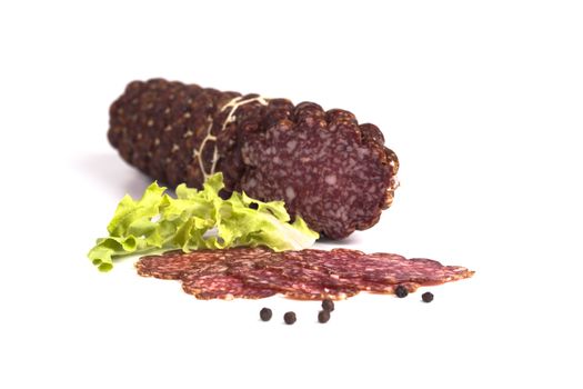 Sliced salami with black pepper isolated on white background