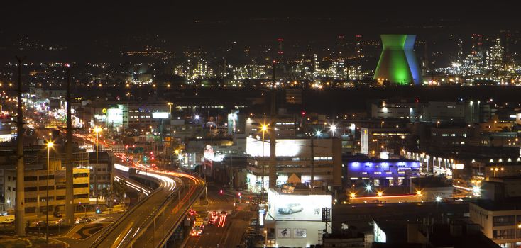 panorama night view over rafinary comercial center and highway