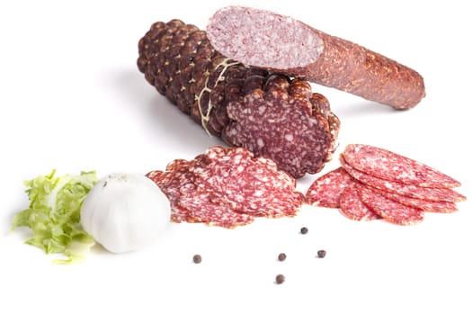 Sliced salami with garlic and black pepper isolated on white background