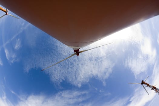 ornage wind turbine wide wiew  with blue sky