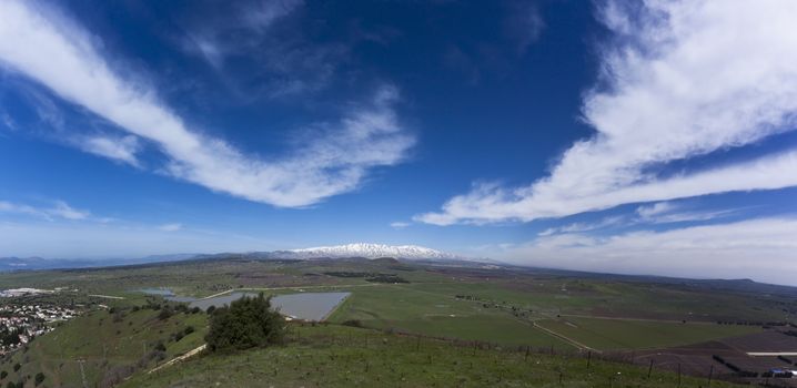 golan hights with hermon mountain covered with snow at the syrian border