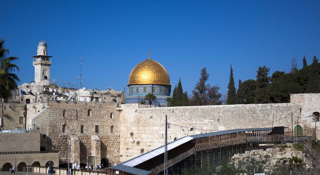 jerusalm western wall and goldem mosque blue sky