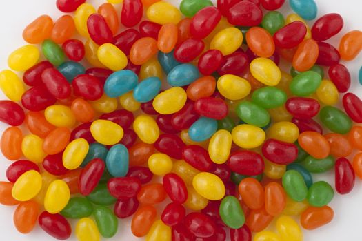 round shape colored candy pile on white background