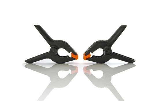 Plastic clamps for connecting parts on a white background