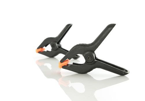 Plastic clamps for connecting parts on a white background