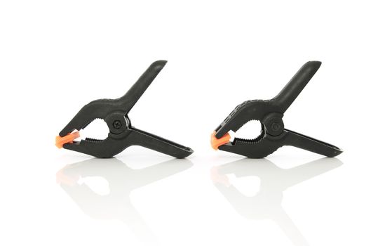 Plastic clamps for connecting parts on a white background