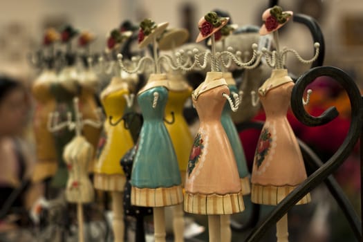 woman doll craft artistic key holders in a row