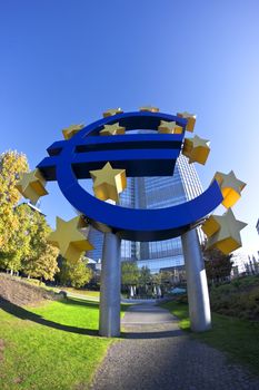 blue euro sign statue in frankfurt germany blue sky background