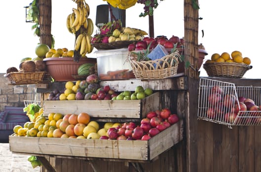 colorfull exotic fruit stand with all kind of tropical fruits 