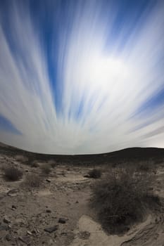  white clouds and blue sky in a rocky desert