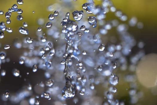 water drops in the air on colored background  abstract