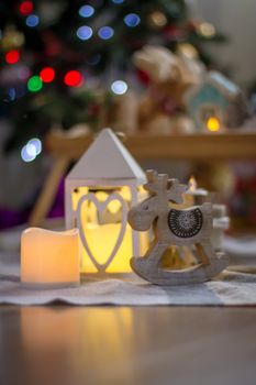 Burning lantern and wooden reindeer christmas decoration