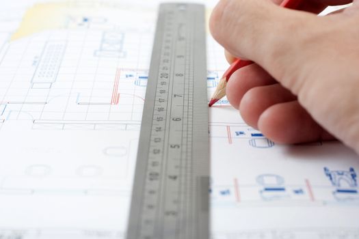 drawing a house plan with pencil and ruler