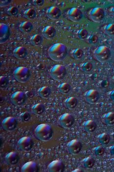 abstract colored watter drops closeup on cd 