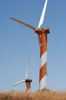 electric power generating wind turbine in the summer