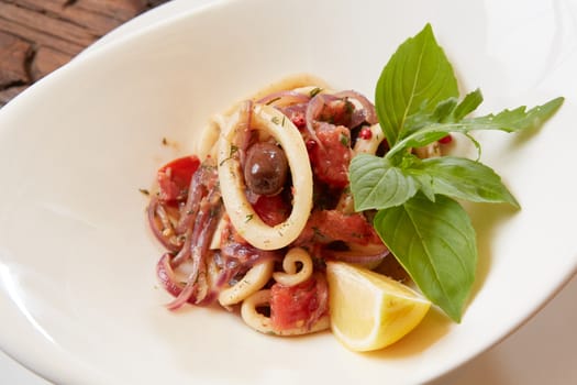 Seafood Salad with Shrimps and Squid Rings. Shallow dof