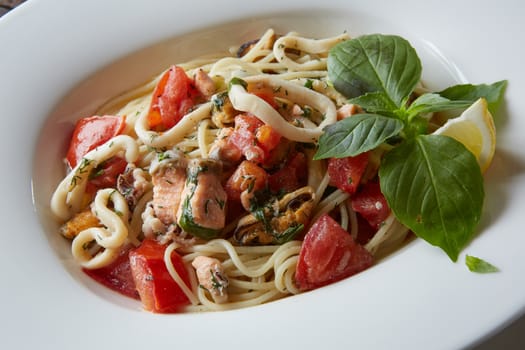 Seafood pasta Spaghetti with Clams, Prawns, Seafood Cocktail close up.