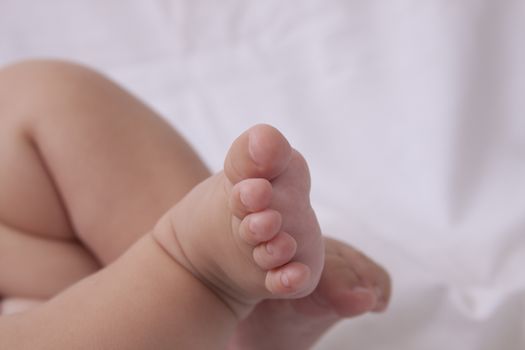 baby foot with toes on white background