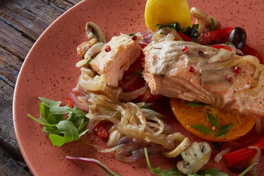 Steamed salmon with vegetables on a plate