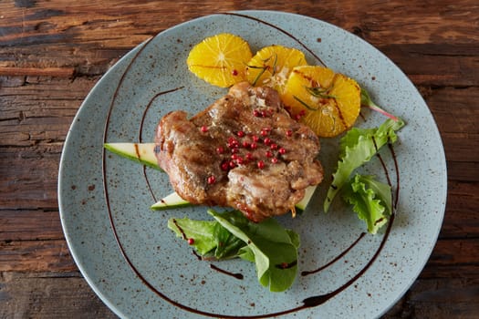 Chicken Steak with oranges and greens. Shallow dof