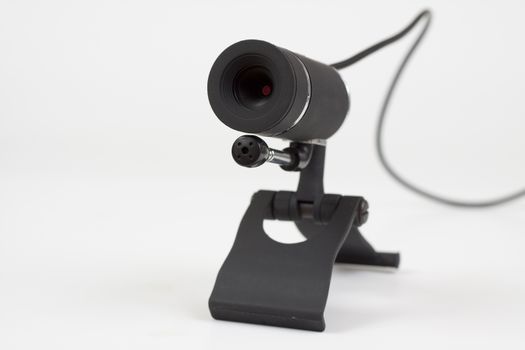 black webcam with microphone on white background