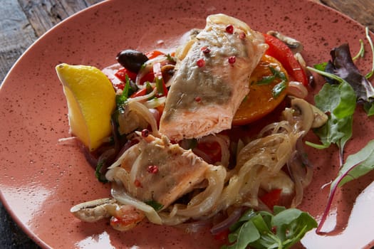 Steamed salmon with vegetables on a plate