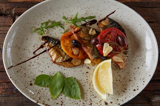The fried mackerel with vegetables. Shallow dof