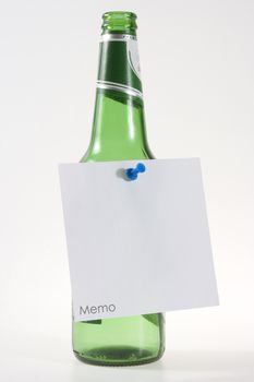 beer bottle with white memo note