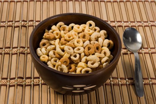 morning cornf lakes in a wood bowl with spoon