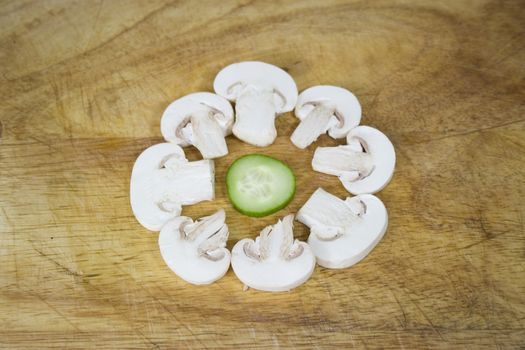 sliced mushroom circle round a cucumber slice