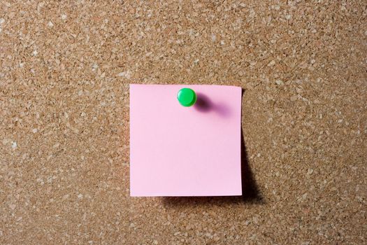 pink note with green push pin