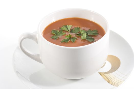 tomato soup with parsley on wwhite background